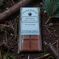 Packaged maple musk wax melts with a label on a natural background
