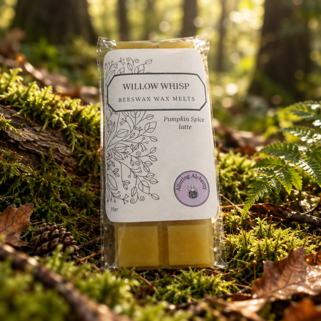 A packaged bar of Willow Whisp beeswax wax melts, specifically Pumpkin Spice latte, in a clear plastic sleeve on a light wood background.