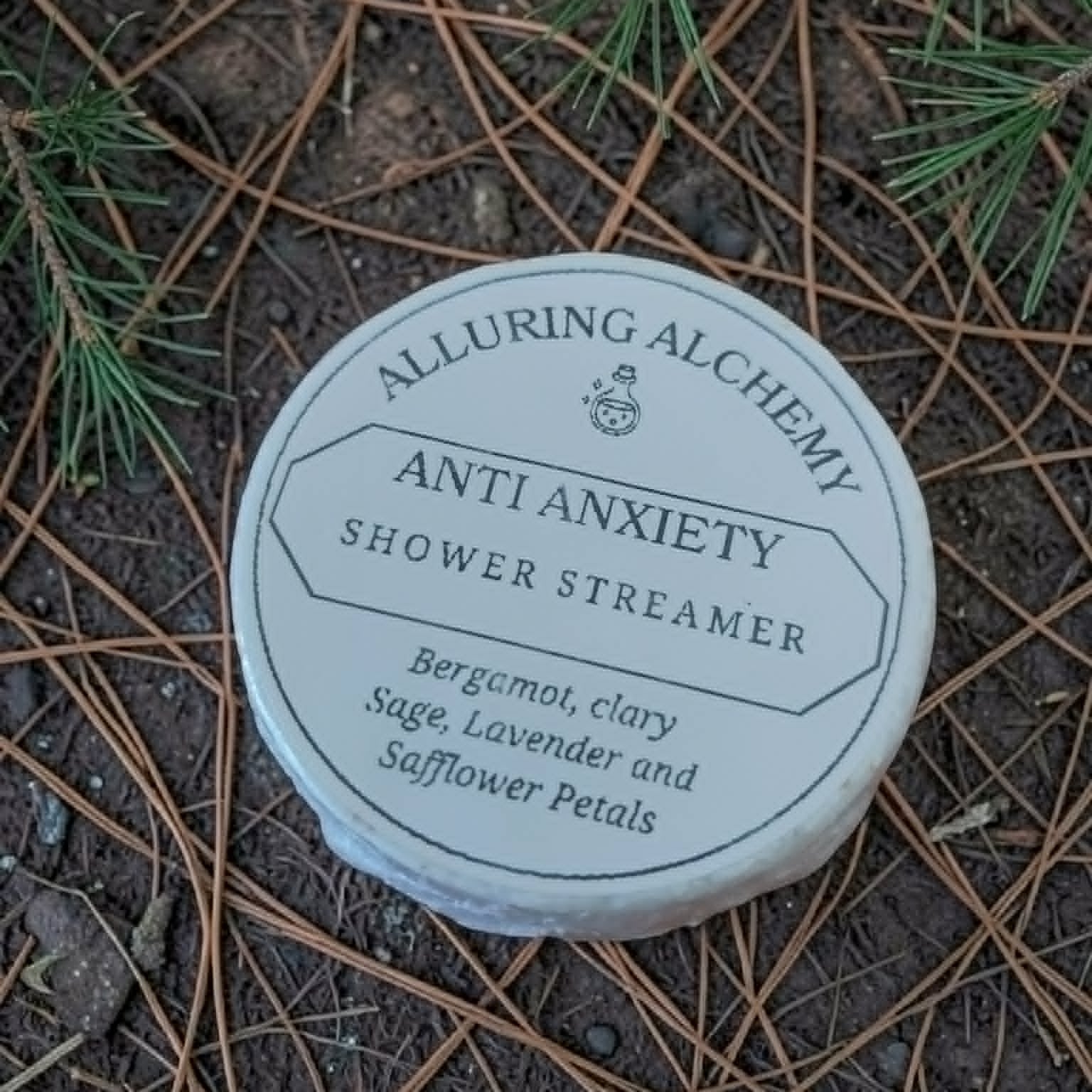 Anti Anxiety Shower Streamer by Alluring Alchemy on a natural background with pine needles.