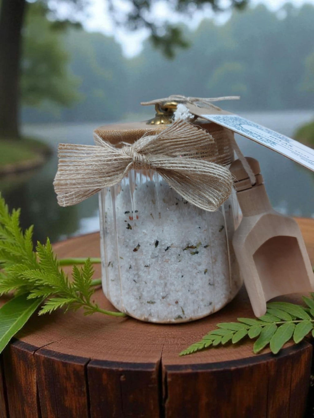 Jar of bath salts with a decorative bow on a wooden surface with a natural background