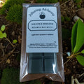 Pack of Alluring Alchemy Solstice Whisper wax melts on a natural background