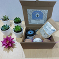 Pamper gift set with plants and products on a wooden surface